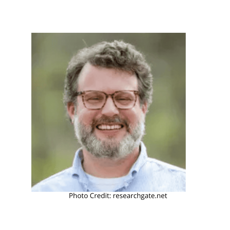 a man with a beard and glasses