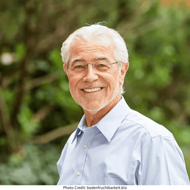 a man smiling at the camera